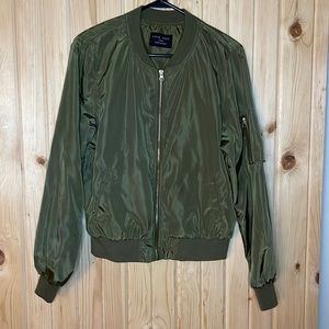 Olive green bomber jacket with gold accents